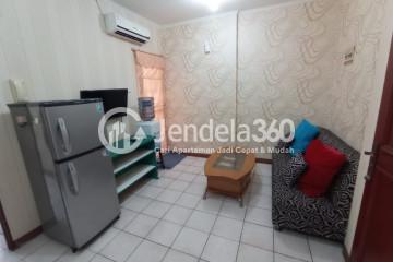 Living Room Cozy 2BR Apartment Middle Floor with Swimming Pool View at Mediterania Gajah Mada Apartment