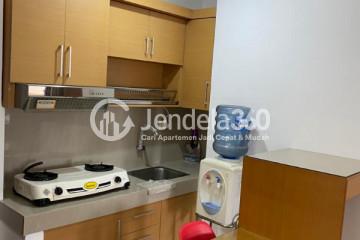 Kitchen Homey 2BR Apartment Low Floor with City View at Mediterania Gajah Mada Apartment