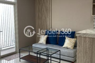 Living Room Comfortable 2BR Apartment at Ciputra International Puri Middle Floor