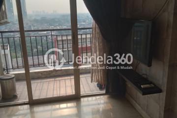 Living Room Trendy 2BR Apartment Middle Floor with Swimming Pool View at Gardenia Boulevard Apartment