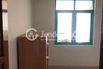 Bedroom Relaxed 1BR Apartment High Floor with City View at Pesona Bahari Apartment