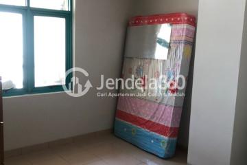 Bedroom Relaxed 1BR Apartment High Floor with City View at Pesona Bahari Apartment