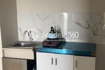 Kitchen Restful 2BR Apartment at Modernland Golf Apartment Tower Kuning