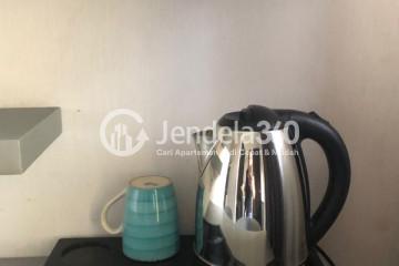 Kitchen Restful 1BR Apartment at Kebagusan City Apartment Low Floor