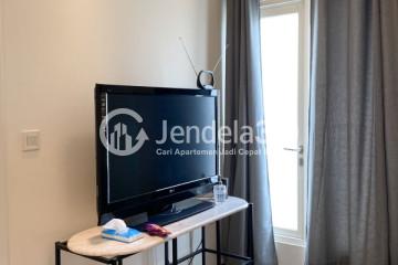 Living Room Tidy 1BR Apartment High Floor with City View at Podomoro Golf View Apartment