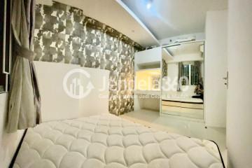 Bedroom 1 Relaxed 2BR Apartment at Bassura City Apartment Tower Geranium